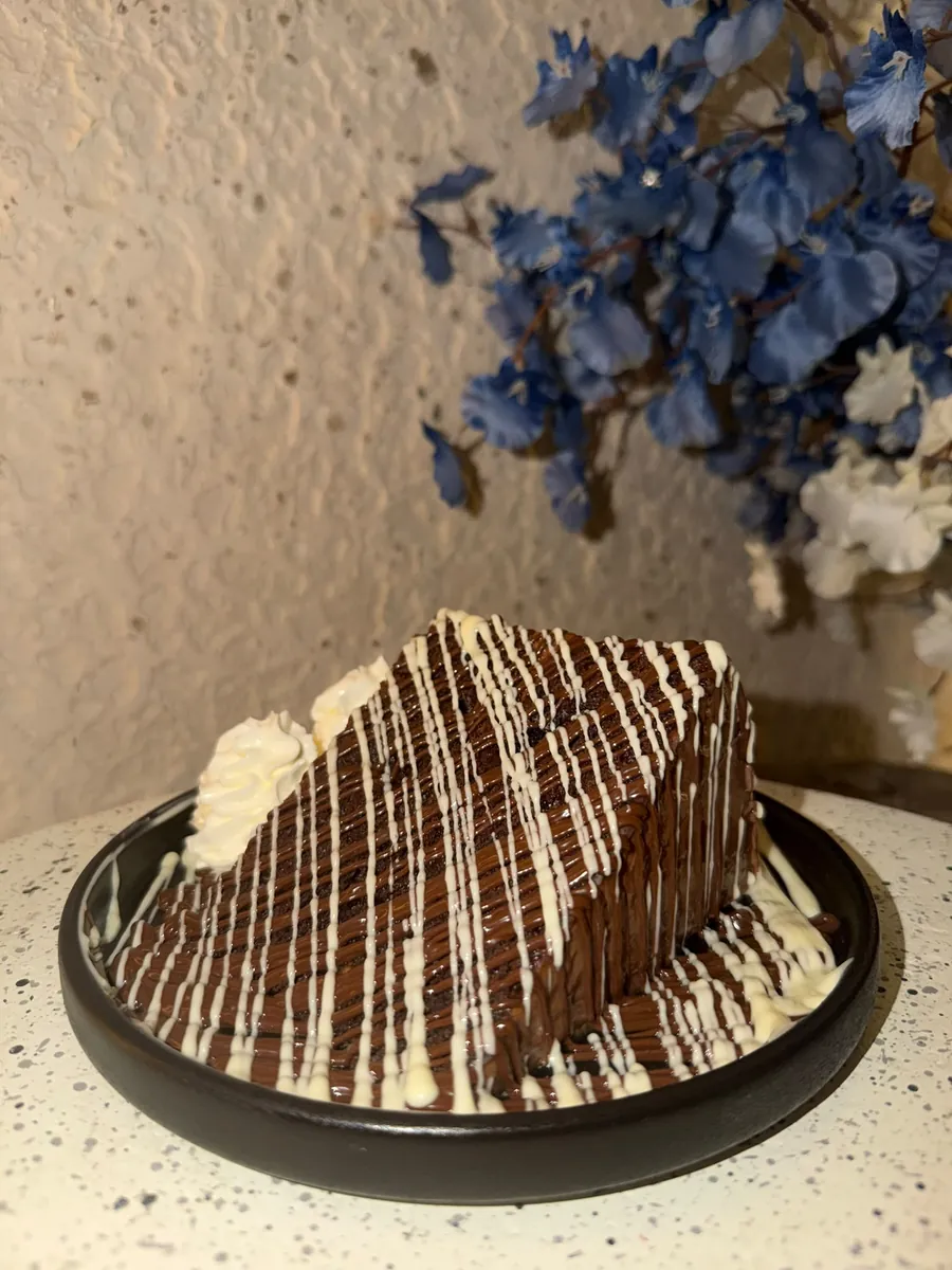 Chocolate cake with white chocolate drizzle