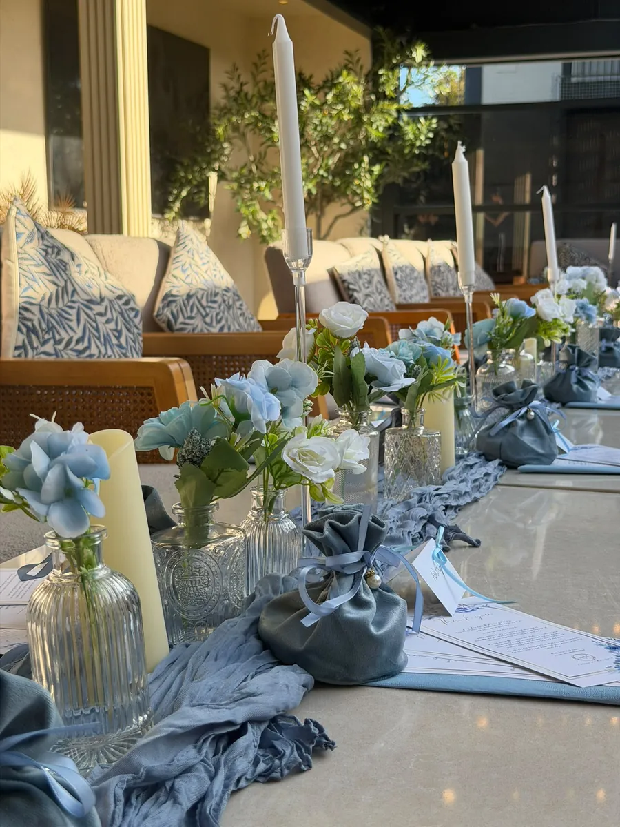 Candles and florals down the event table