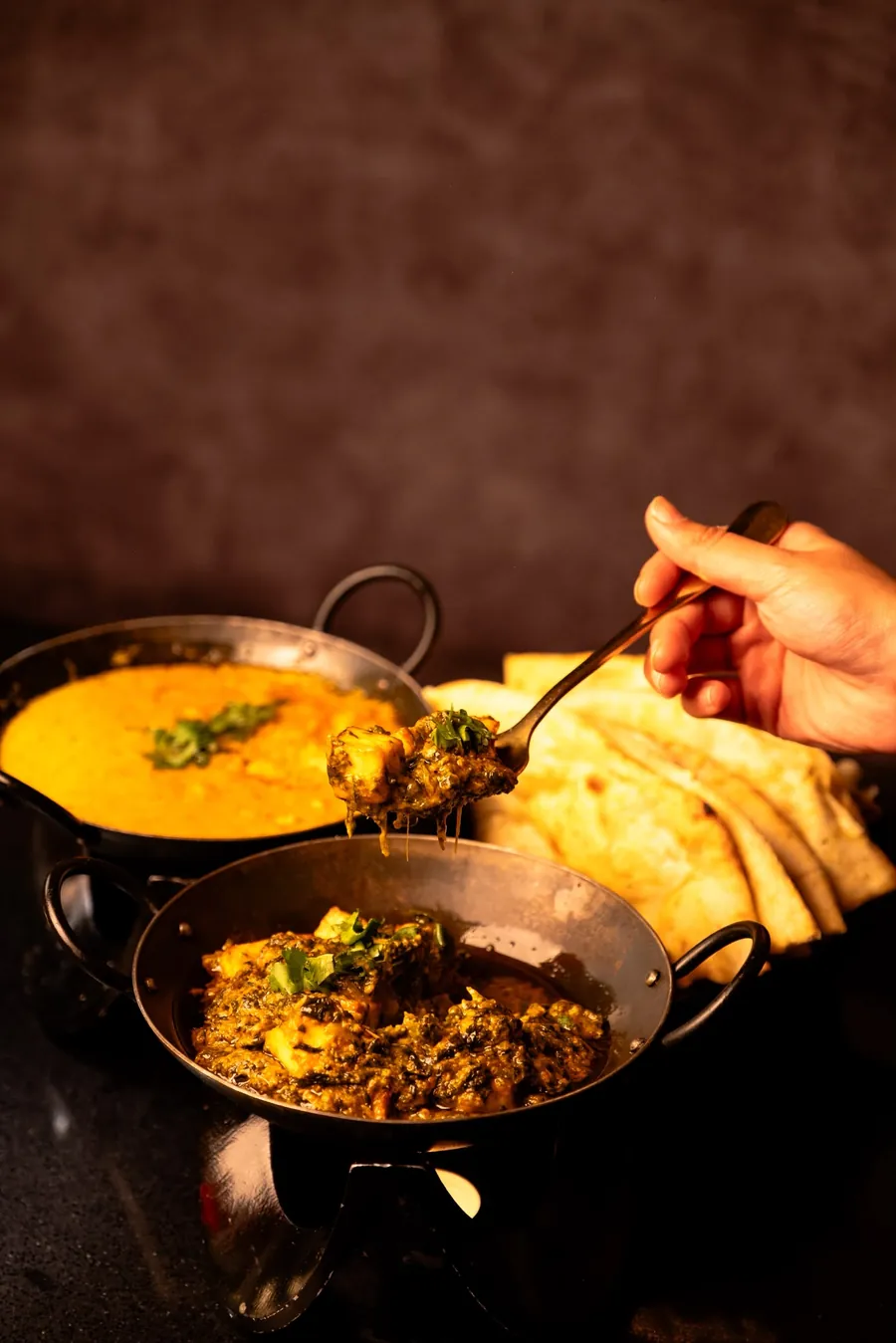 A spread of curries and naan
