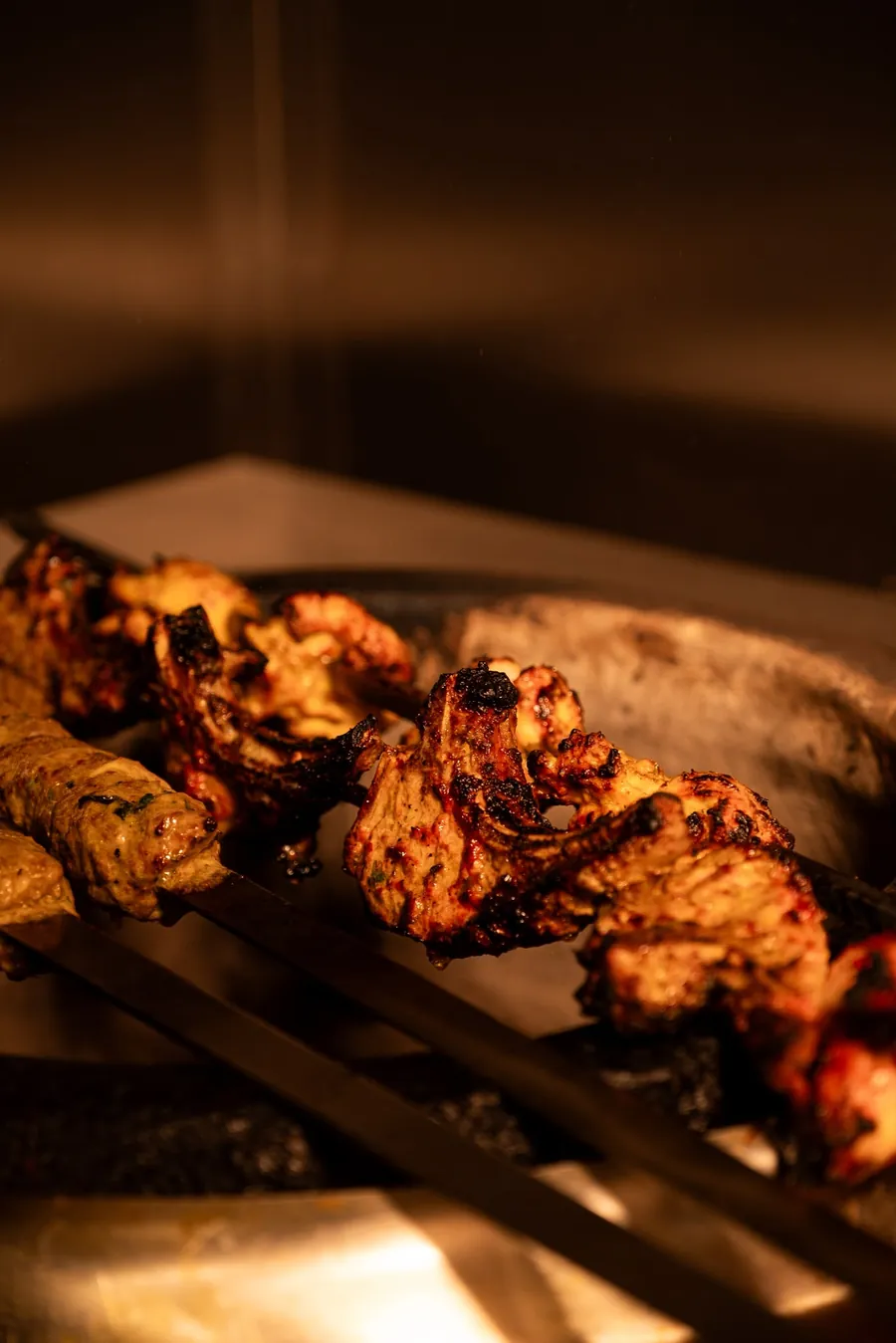 Chicken tikka skewers fresh from the grill