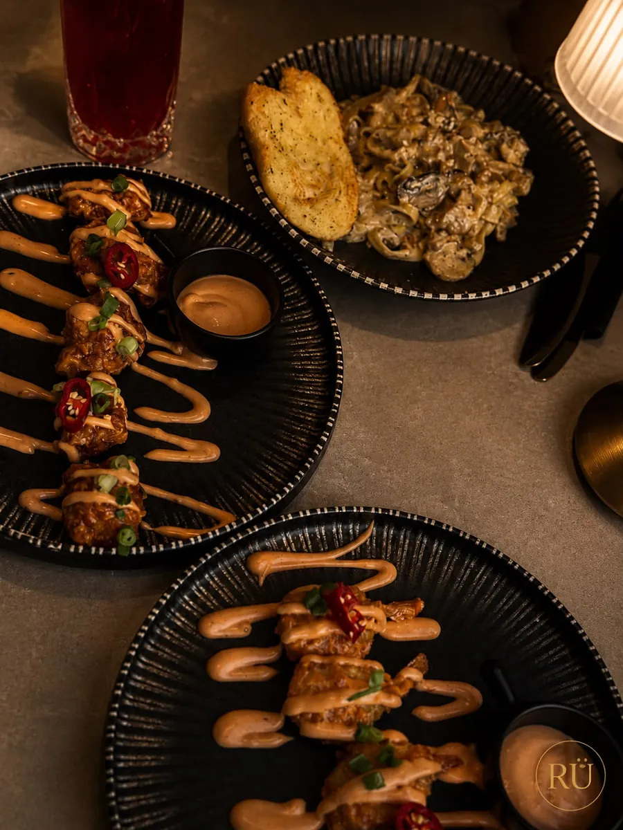 Small plates with drizzled sauces